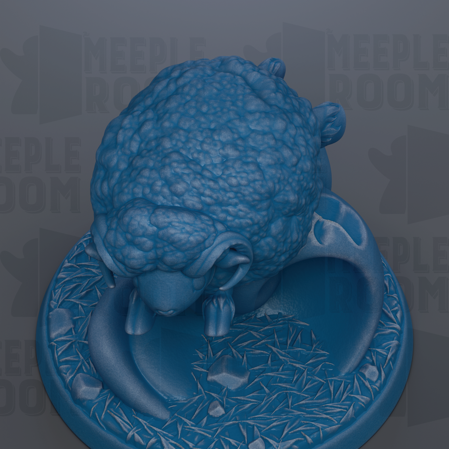 A blue, textured sheep figurine is displayed on a blue base with a patterned design.