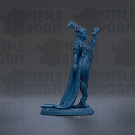A blue figurine of a woman with a long flowing dress and a crown, standing on a pedestal against a dark background with repeated text.