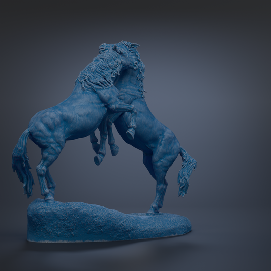 A blue statue of two horses standing on a rock, facing each other.