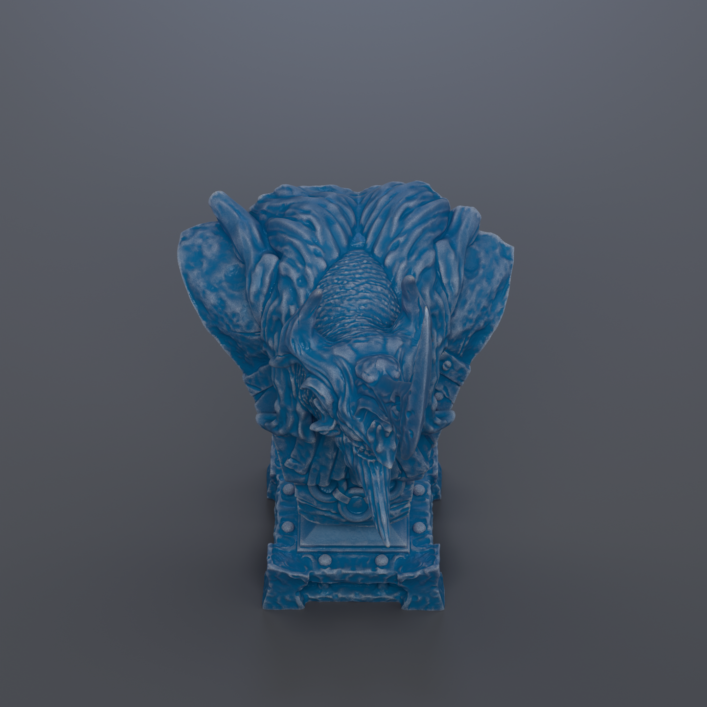A blue, sculpted statue of a dragon-like creature with intricate details and a fierce expression.