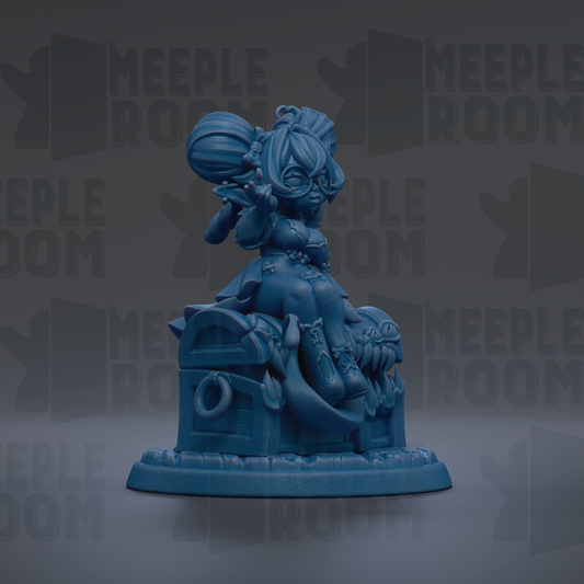 A blue figurine of a person sitting on a chest, with a crown on their head, is the main focus of the image.