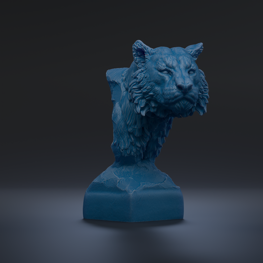 A blue, sculpted statue of a tiger's head is displayed against a dark background.