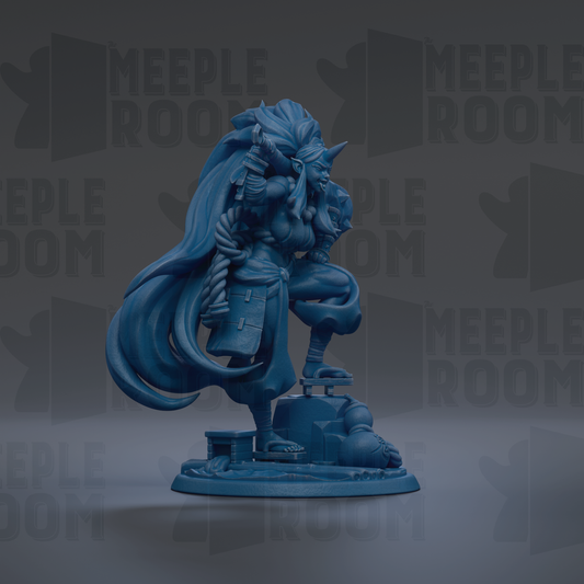 A blue figurine of a person with long hair and a flowing robe, standing on a platform and holding a weapon.