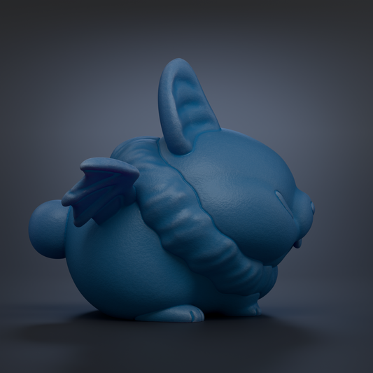 A blue, winged, cartoon-like rabbit figurine is shown against a dark background.