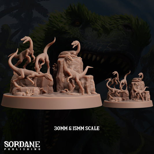 a collection of dinosaur figurines in various poses, including one on a rock formation and others on a base. The figurines are in a 30mm and 15mm scale, as indicated by the text.