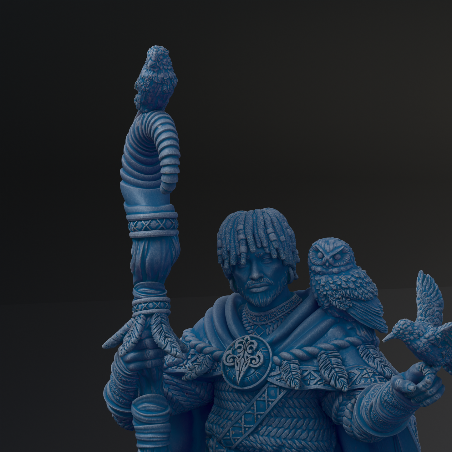 A blue statue of a man holding a bird and a staff, with intricate details and designs.