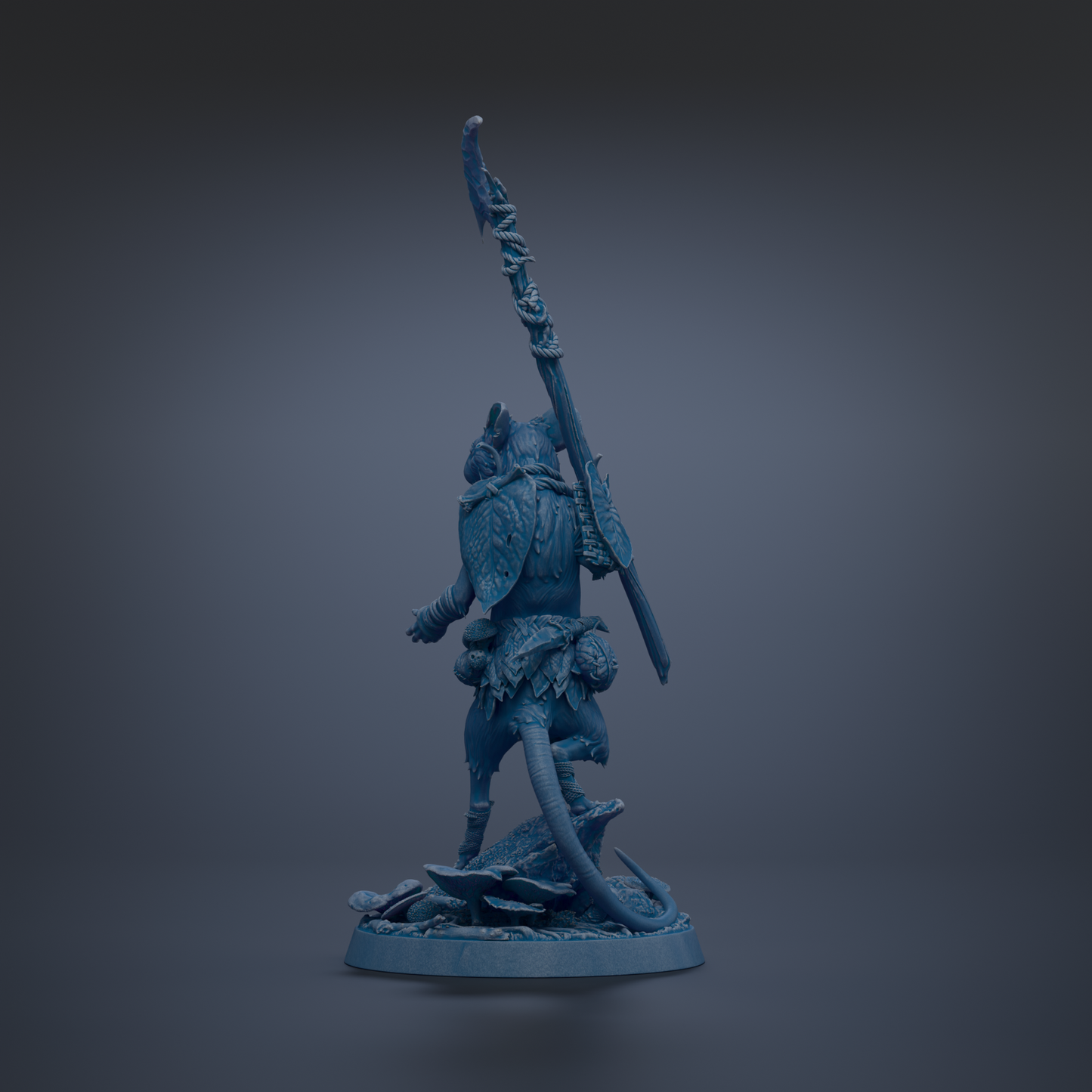 A blue figurine of a warrior standing on a rock, holding a spear and shield.