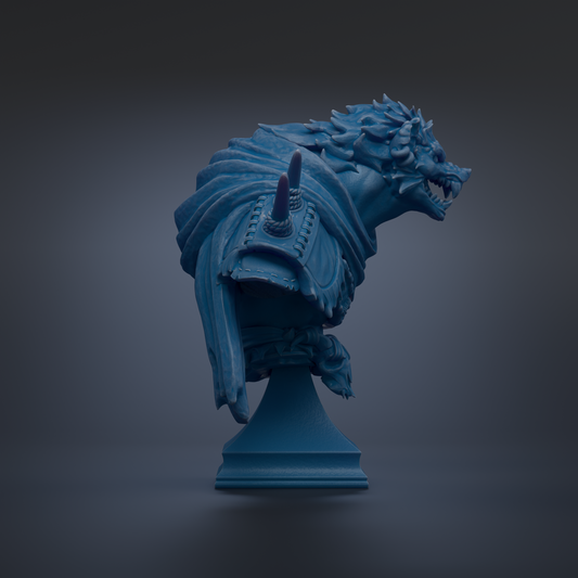 A blue, sculpted statue of a fierce-looking creature with sharp teeth and claws, standing on a pedestal against a dark background.