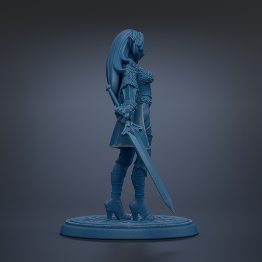 A blue figurine of a female warrior standing with a sword in her right hand.