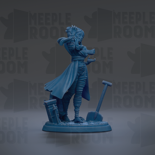 A blue figurine of a woman with a flowing cape and a shovel, standing on a base.