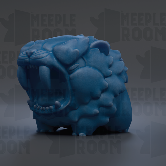 A blue, sculpted animal with sharp teeth and an open mouth, resembling a fierce-looking creature.