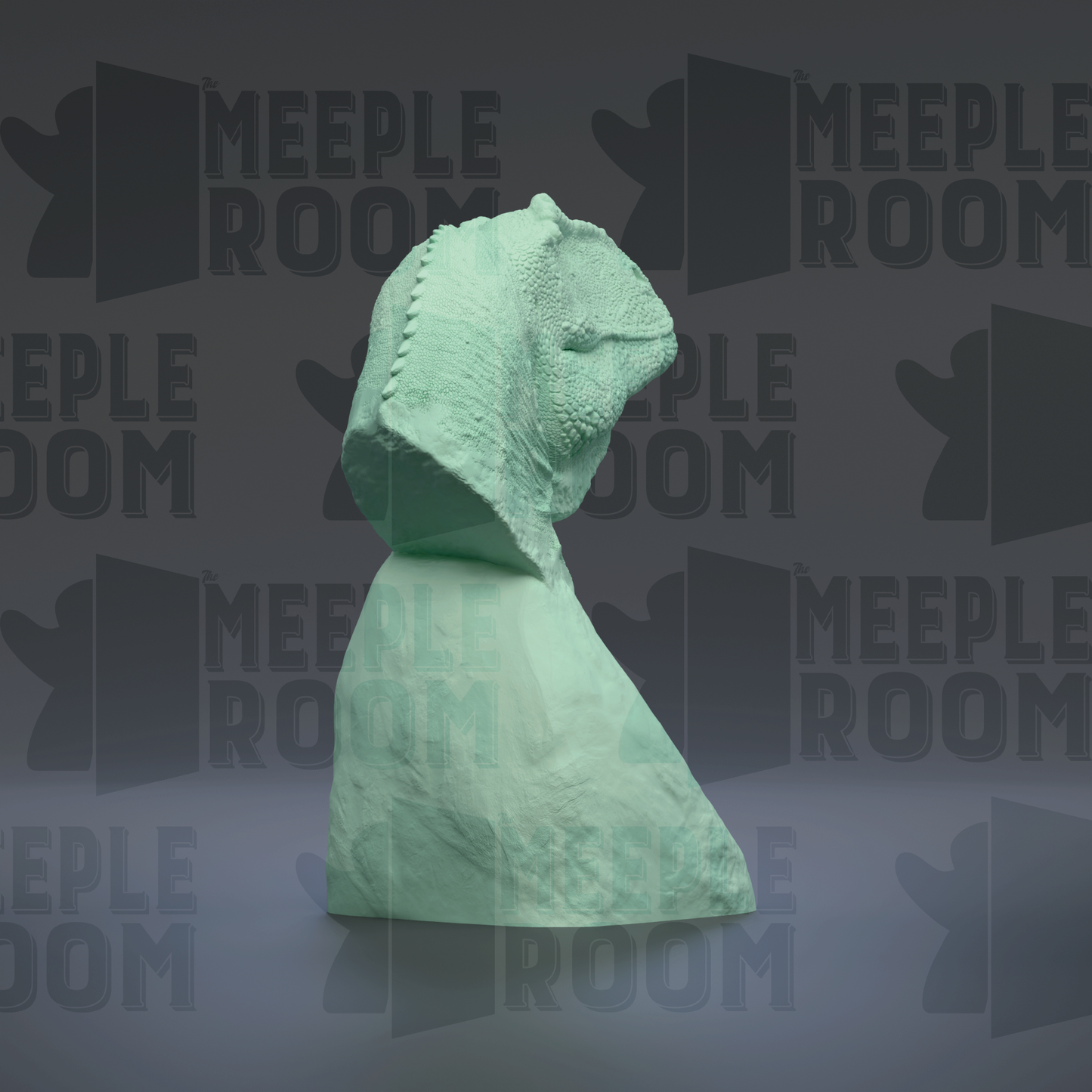 A green, textured sculpture is displayed against a dark background with repeated text and logos.