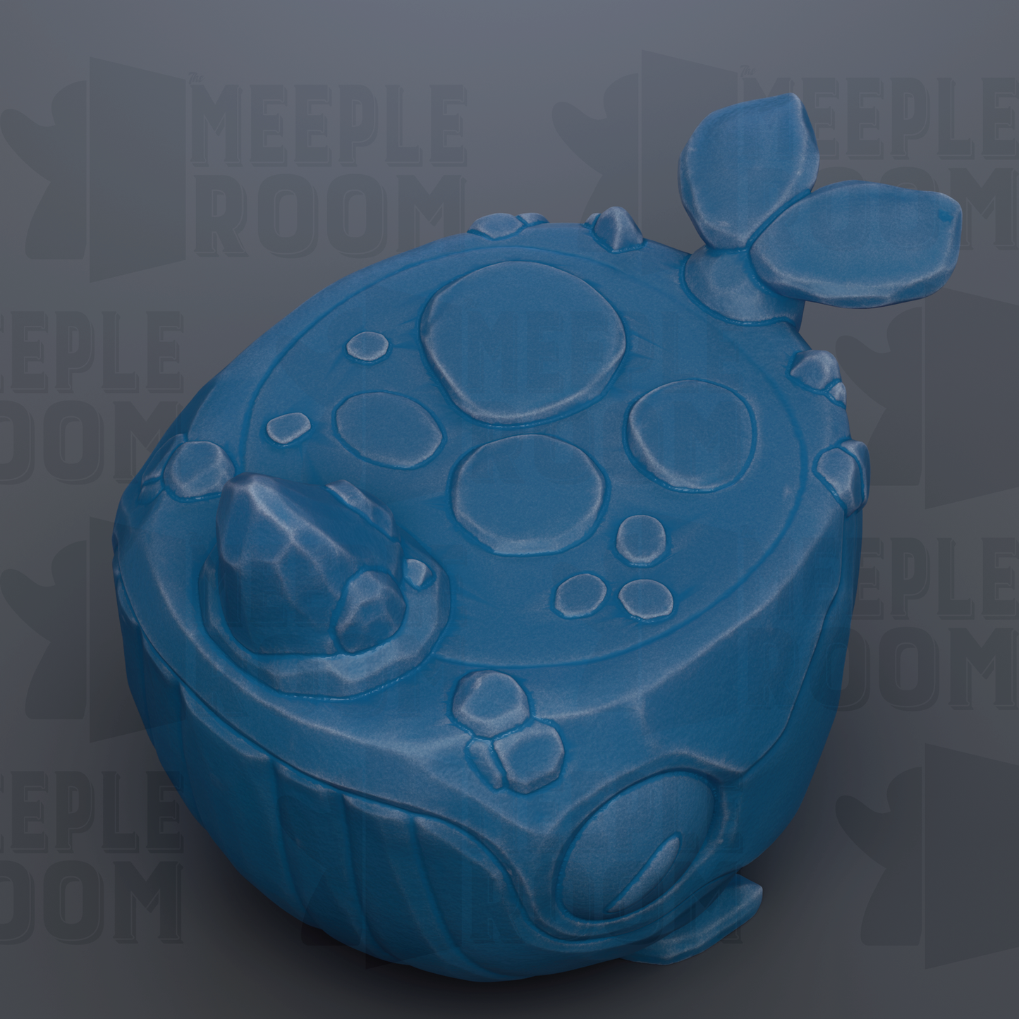 A blue, spherical object with a textured surface and circular shapes, resembling a toy or figurine.