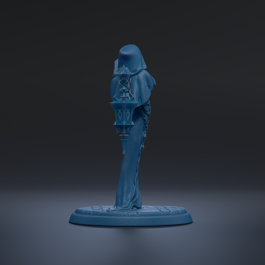 A blue statue of a person standing on a base, with a dark background.