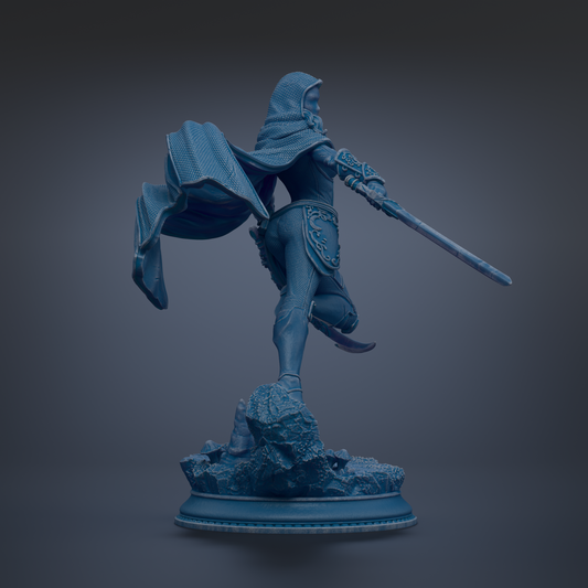 A blue statue of a warrior figure with a flowing cape and sword, standing on a rocky base.
