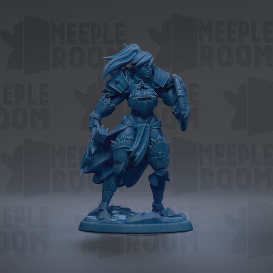A blue figurine of a female warrior standing in a fighting stance, holding a shield and sword.