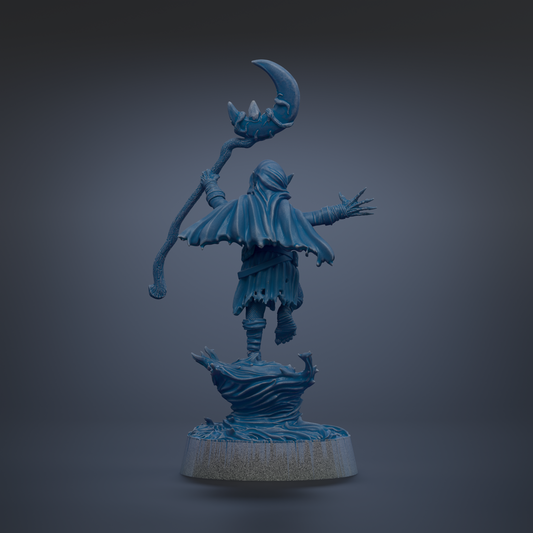 A blue, 3D-rendered statue of a figure holding a staff and a crescent moon, standing on a rock.