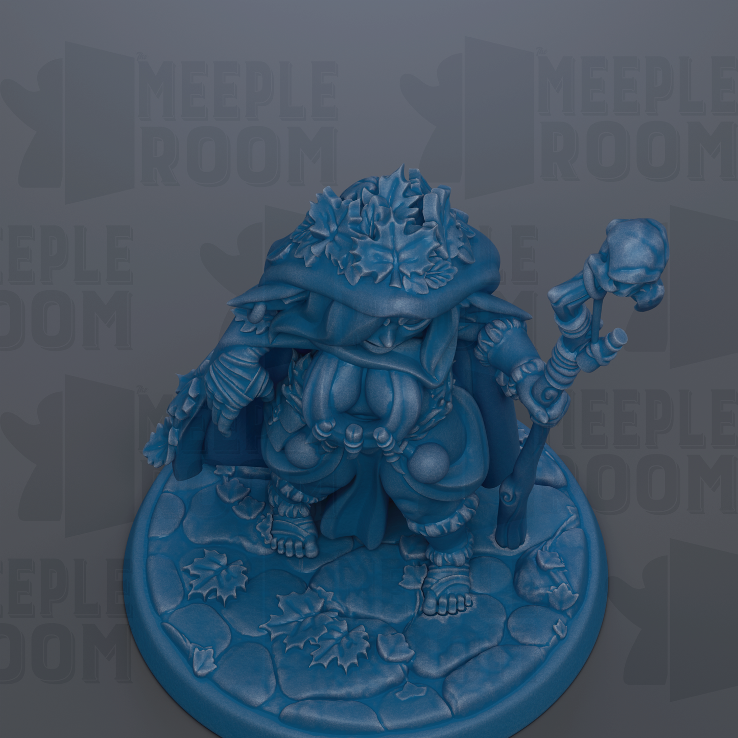 A blue figurine of a fantastical creature, possibly a dragon or a mythical being, sitting on a stone base and holding a staff.