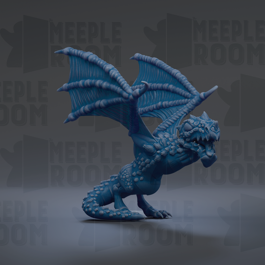 A blue dragon figurine with outstretched wings is the main focus of the image.