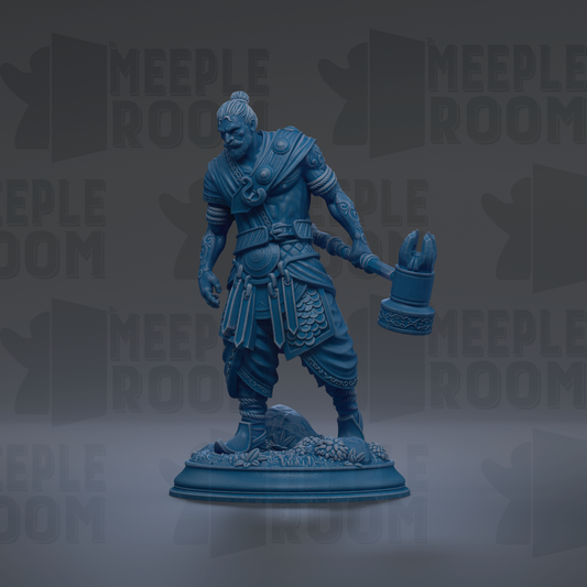 A blue statue of a warrior figure holding a weapon, standing on a base with a decorative design.