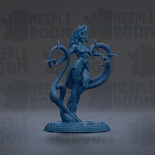 A blue figurine of a female character with a long, flowing skirt and a crown, standing on a base and holding a staff.