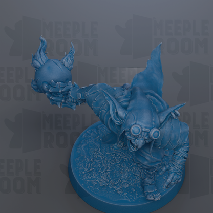 A blue figurine of a creature with horns and a large head, holding a small object in its hand.