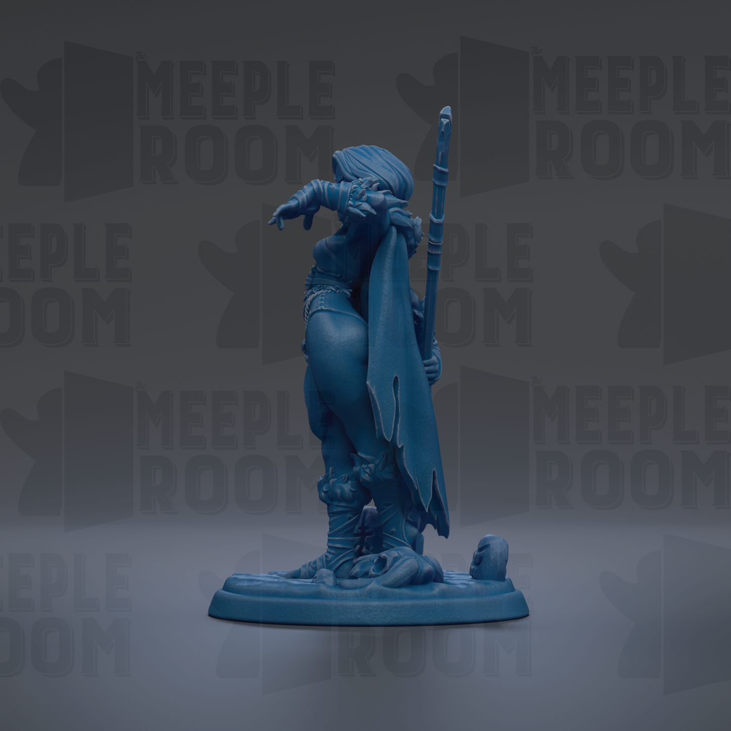 A blue figurine of a person standing on a base, holding a staff and wearing a cape.