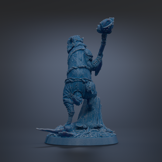 A blue figurine of a person standing on one leg, holding a weapon in their right hand.