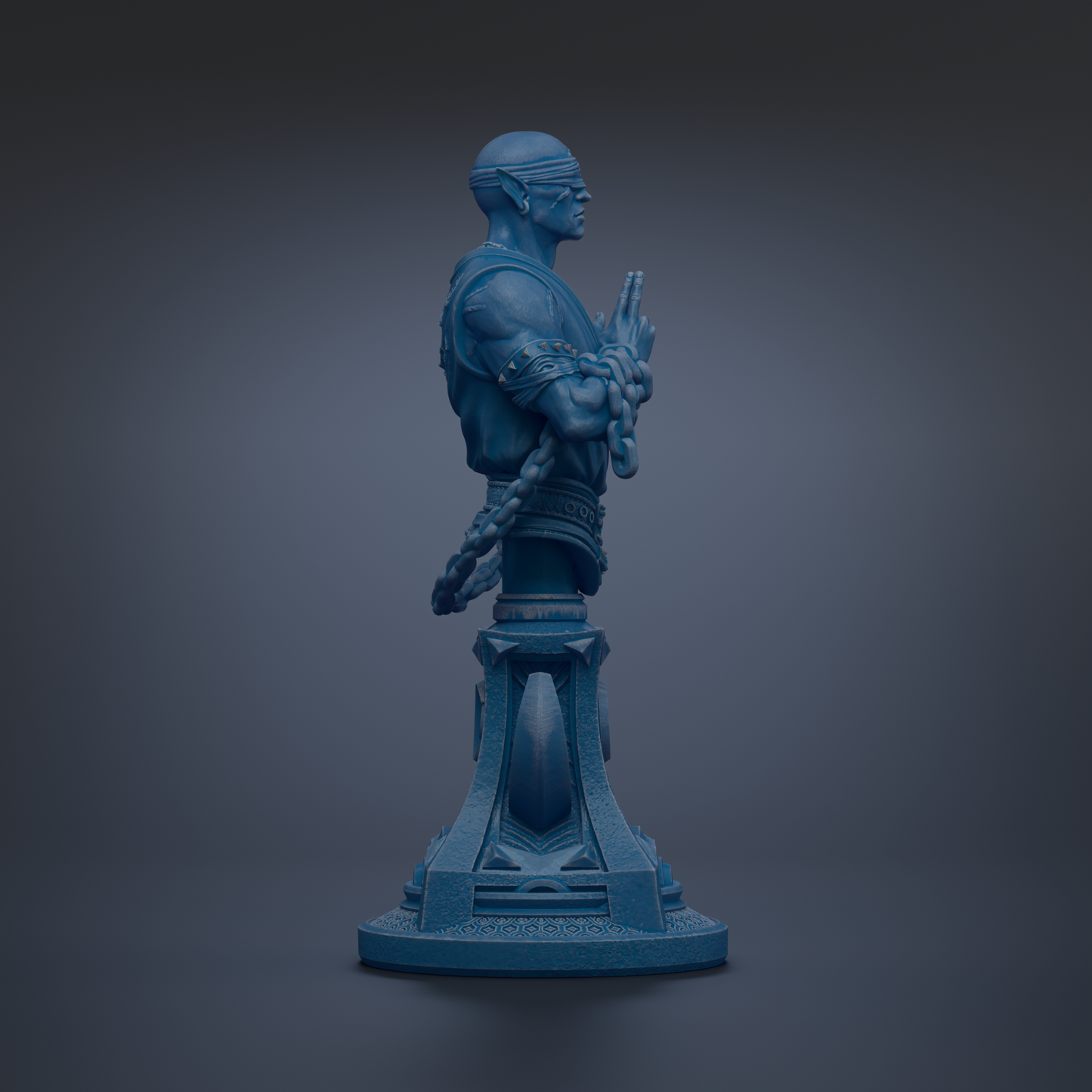 A blue statue of a man with a chain around his neck, standing on a pedestal.