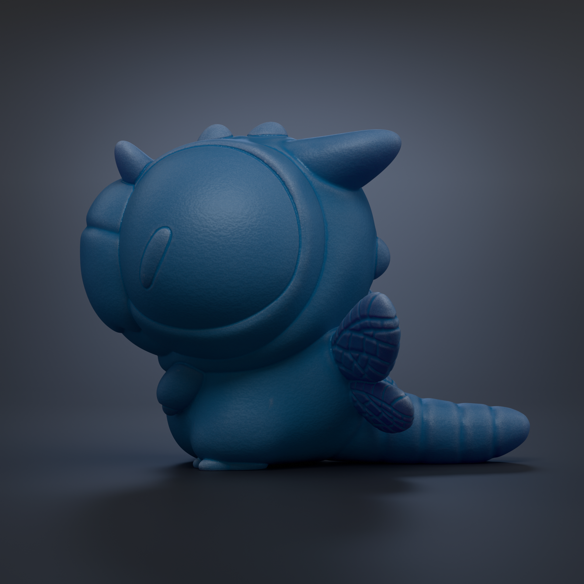 A blue, cartoon-like toy with a large head and small body is shown against a dark background.