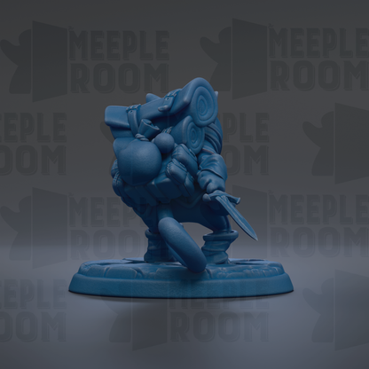 A blue figurine of a character with a sword and shield, standing on a base.