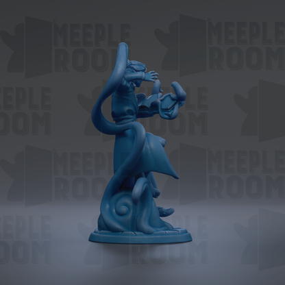 A blue figurine of a person with a long, flowing cape and a pointed hat, standing on a pedestal.