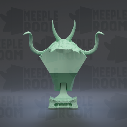 A green sculpture with horns and a pointed top, set against a dark background with repeated text.