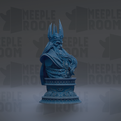 A blue bust of a bearded man wearing a crown, sitting on a decorative base.