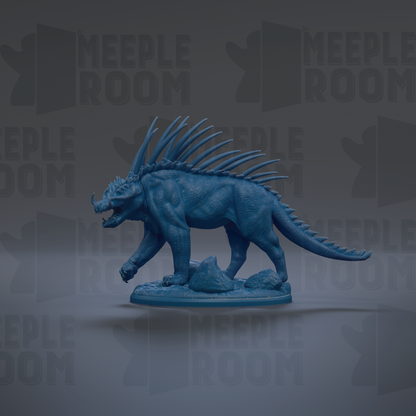 A blue, spiky toy resembling a mythical creature or monster, with sharp teeth and claws, is shown against a dark background with repeated text.