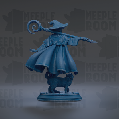 A blue statue of a wizard with a staff, standing on a pedestal and holding a wand, with a cat on its back.