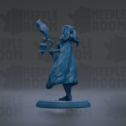 A blue figurine of a woman holding a lantern and a bird, standing on a circular base.