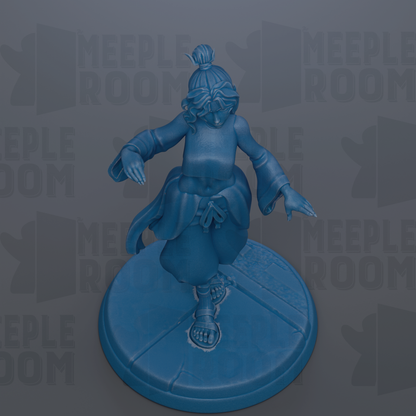 A blue figurine of a person with a bun on their head, standing on a blue base.