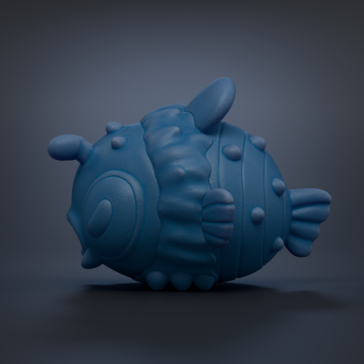 A blue, cartoonish fish-shaped object with a textured, bumpy appearance is shown against a dark background.