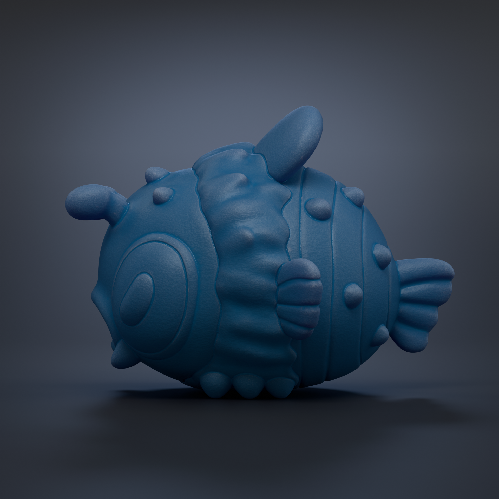 A blue, cartoonish fish-shaped object with a textured, bumpy appearance is shown against a dark background.