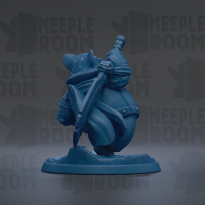 A blue figurine of a character with horns and a sword, standing on a base.
