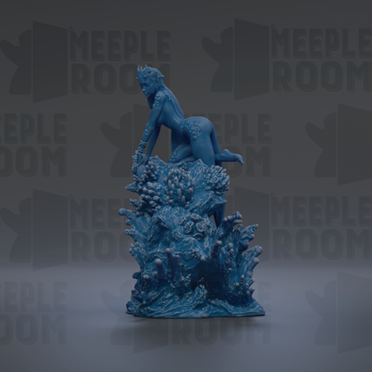 A blue, 3D-rendered statue of a woman sitting on a rock formation, surrounded by a sea of blue and green plants.