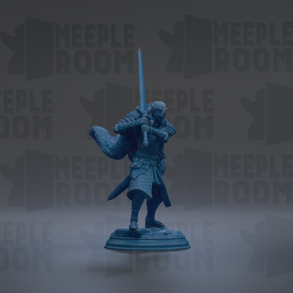 A blue figurine of a warrior standing on a pedestal, holding a sword in one hand and a shield in the other.