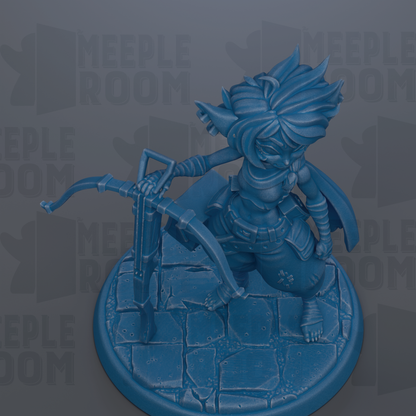 A blue figurine of a character with a pointed hat and sword, standing on a stone base.