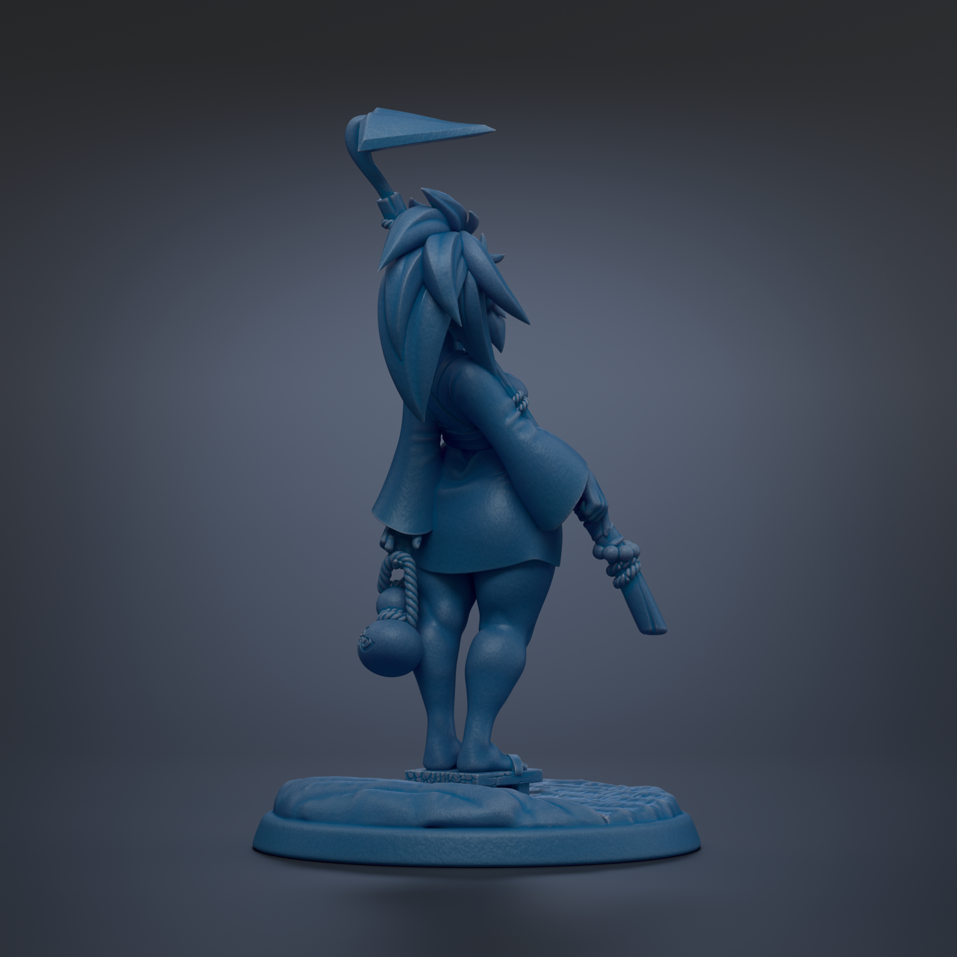A blue figurine of a character with a pointed hat and a sword, standing on a base.