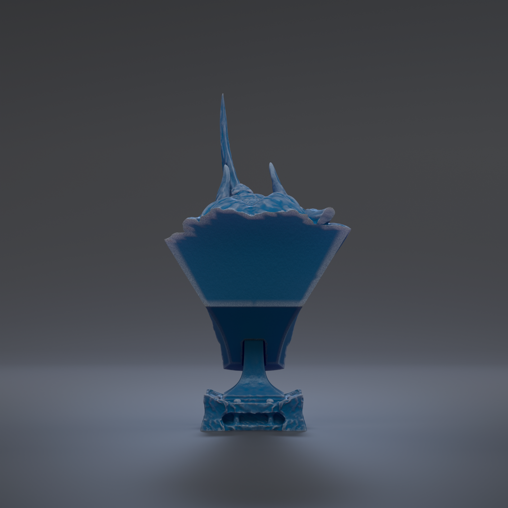 A blue, three-dimensional object with a pointed top and a flat bottom, standing alone against a dark background.