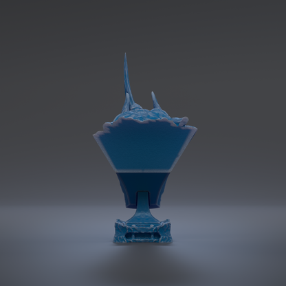 A blue, three-dimensional object with a pointed top and a flat bottom, standing alone against a dark background.