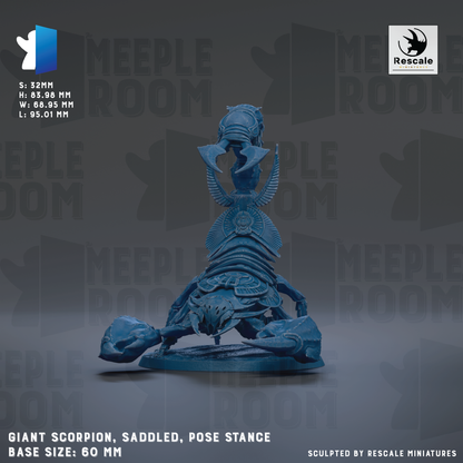 a large blue figurine of a creature with wings and a headdress, sitting on a base and appearing to be in a pose. The creature is described as a "Giant Scorpion, Saddled, Pose Stance" and is shown in a detailed and realistic manner. The image is a sculpture and does not contain any text.
