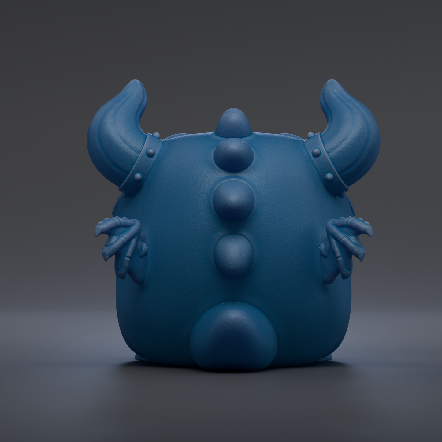 A blue, cartoon-like creature with horns and spikes, sitting on a gray surface.