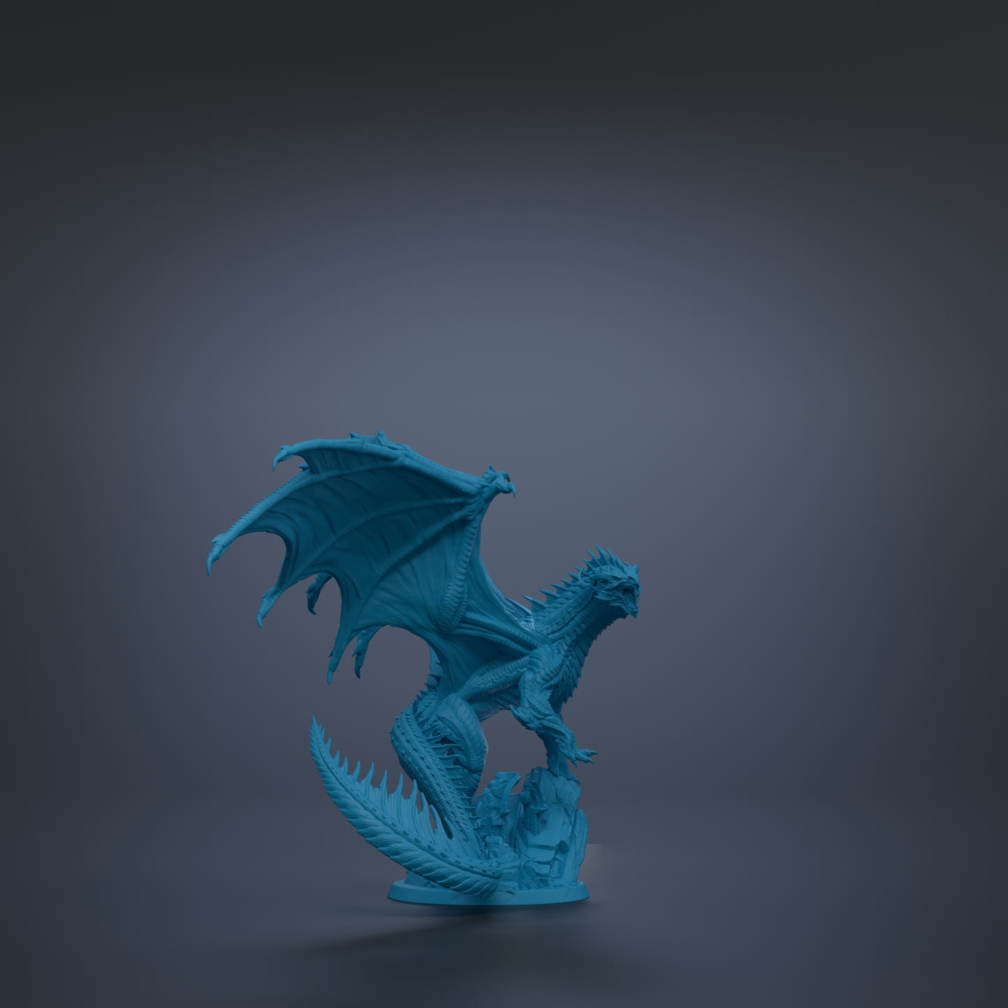 A blue dragon figurine with wings spread, standing on a rock.